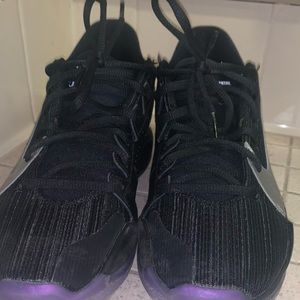 Purple and black Nike zoom freaks